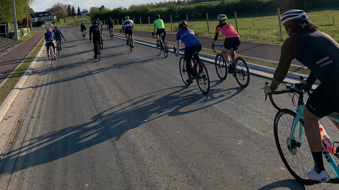 Peloton group on unfinished tarmac