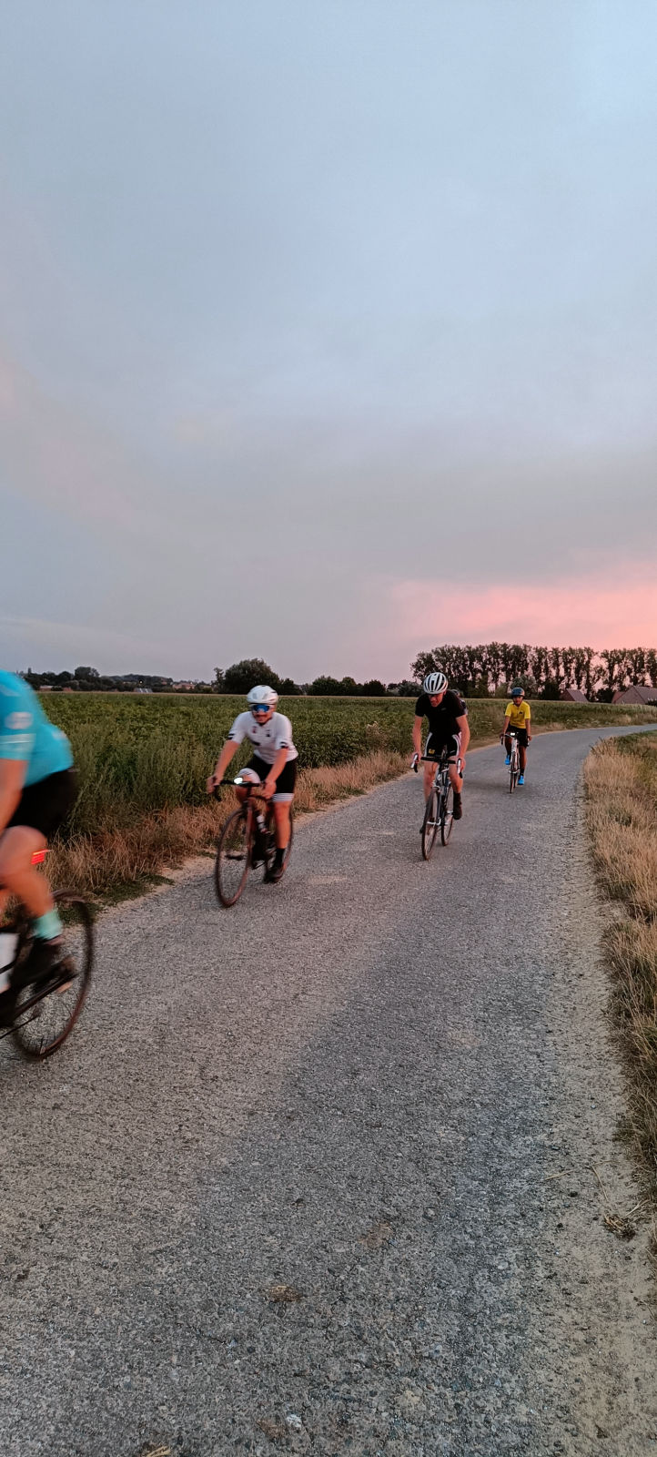 Group of cyclists approaching on countryside road