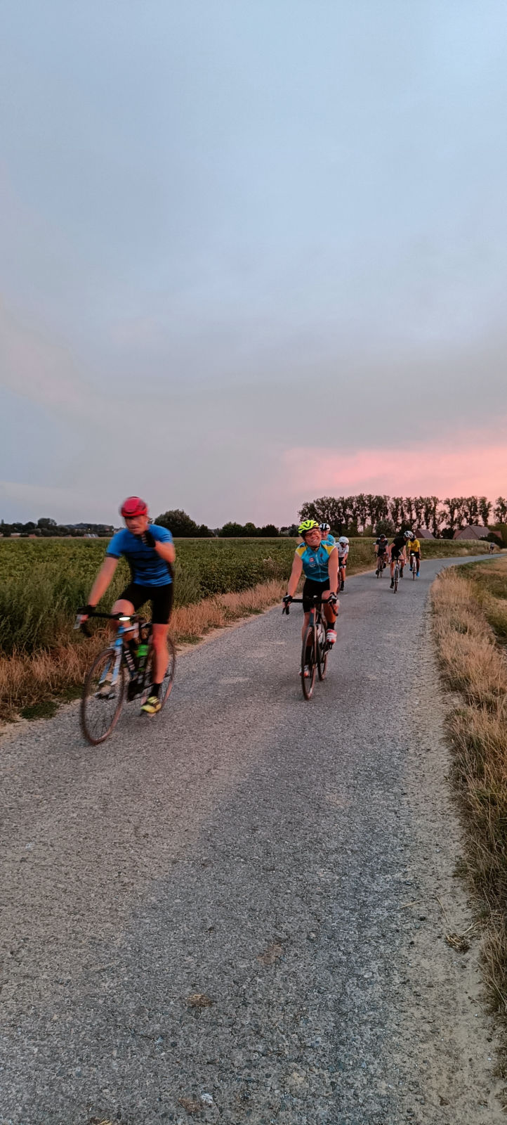 Group of cyclists approaching on countryside road