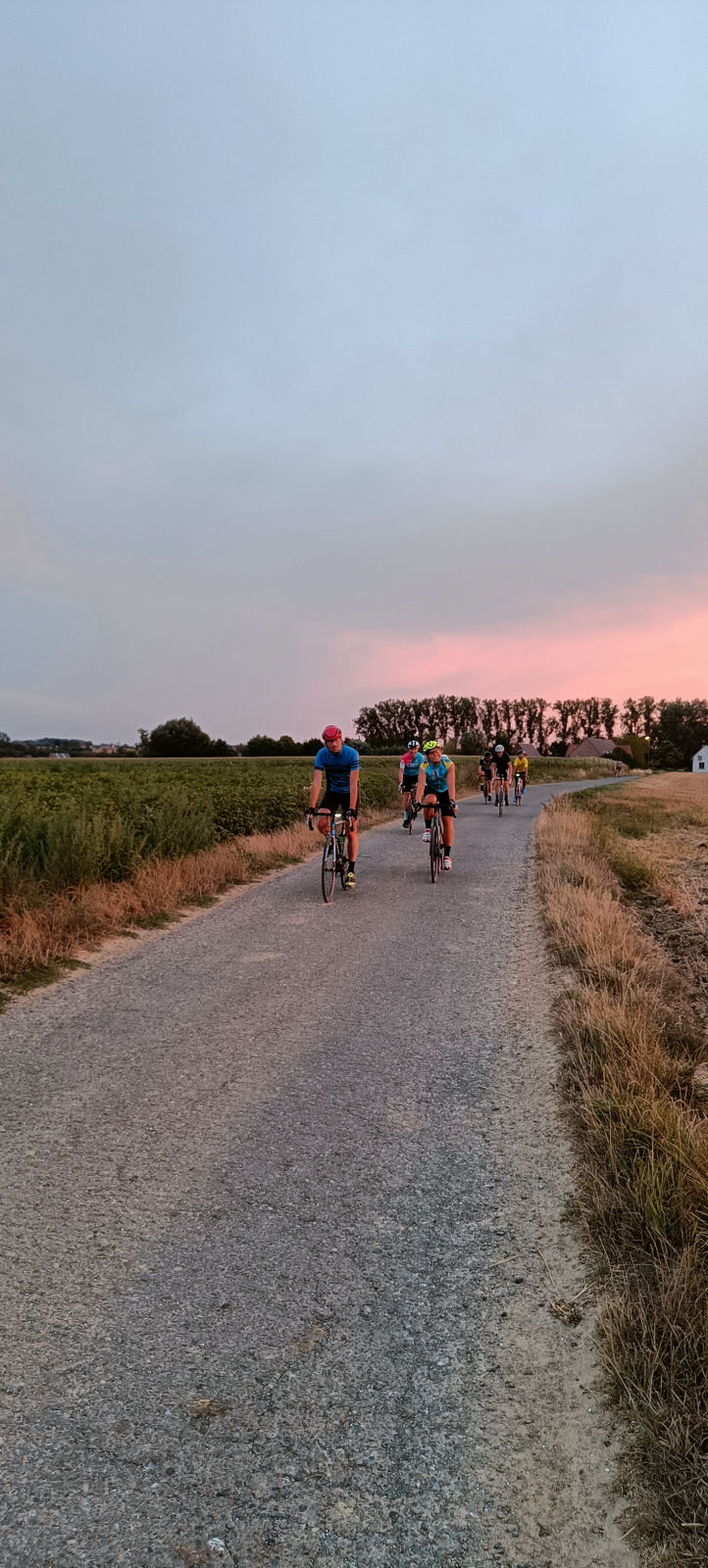 Group of cyclists approaching on countryside road