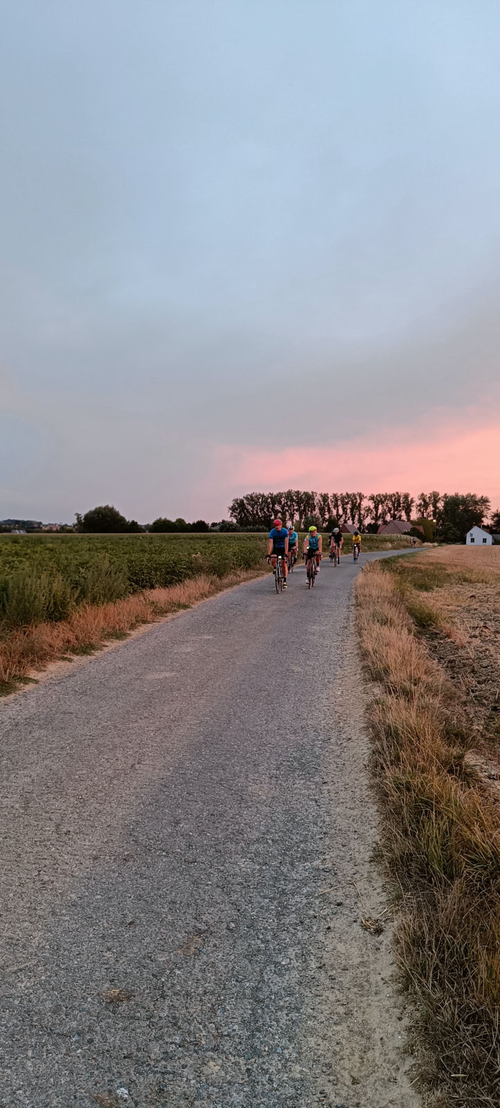 Group of cyclists approaching on countryside road