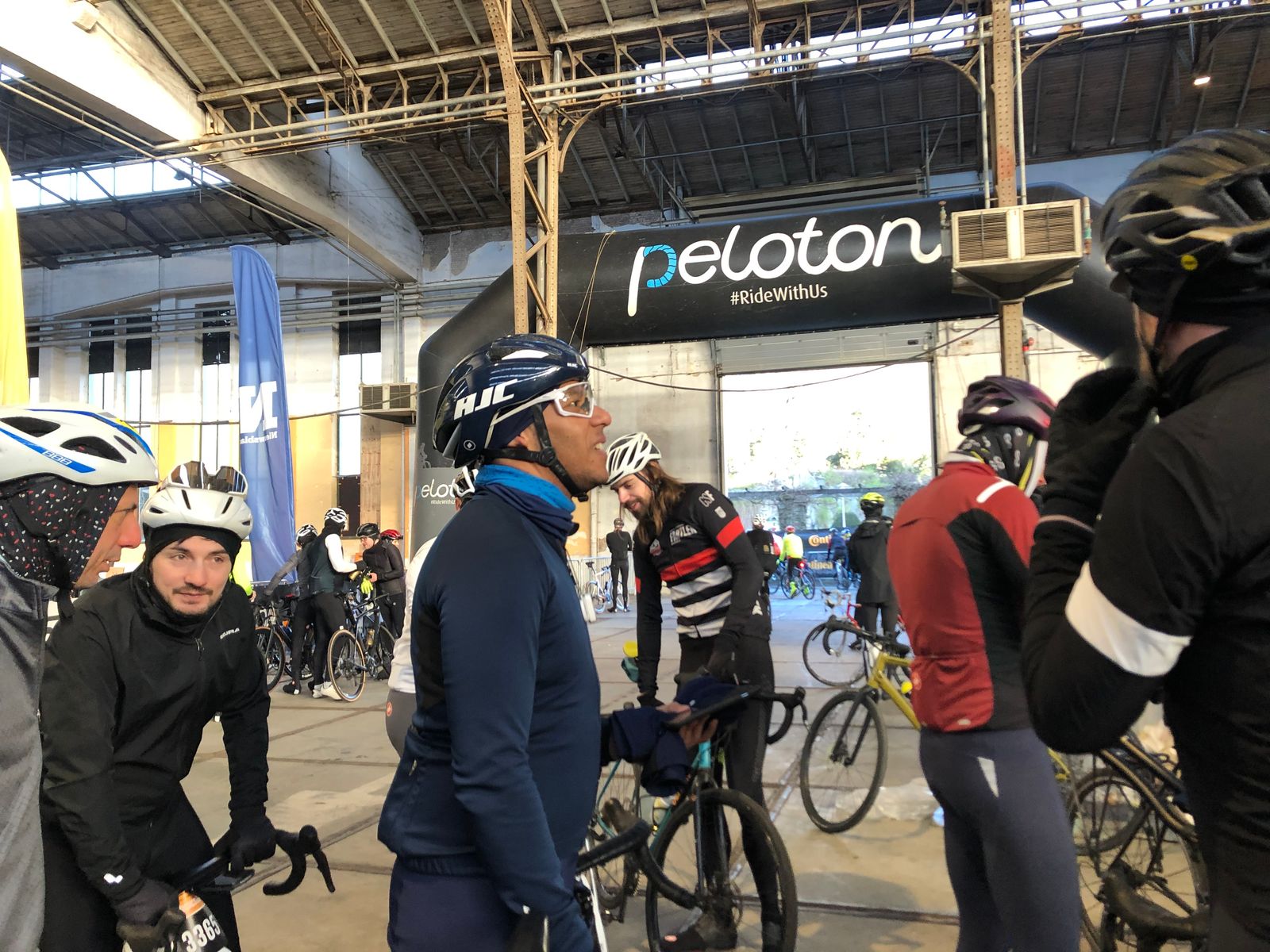 Kim and Brussels Unchained riders standing and waiting at start of Omloop Het Nieuwsblad 2023