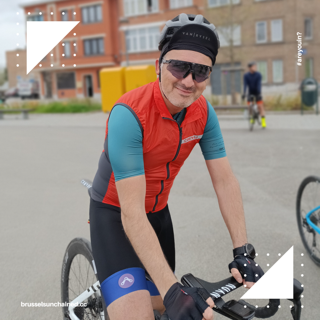 Rider smiling at the camera, waiting for the start of Fast Tuesdays ride