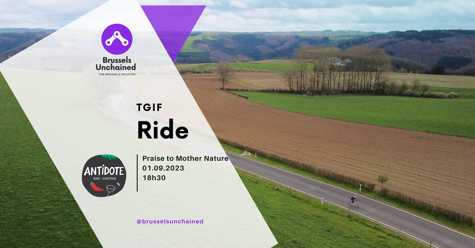 Lone cyclist behind a countryside vista